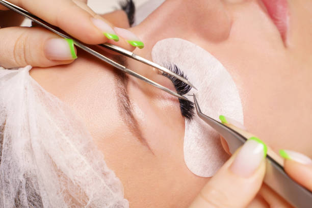 istock Eyelash Extension Procedure. Woman Eye with Long Eyelashes. Close up, selective focus 1333336852