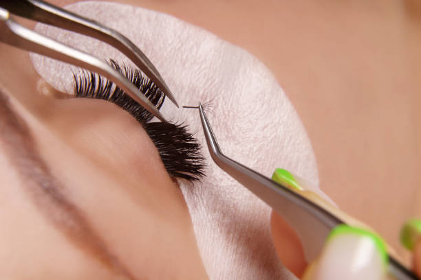 istock Eyelash Extension Procedure. Woman Eye with Long Eyelashes. Close up, selective focus 1333337469