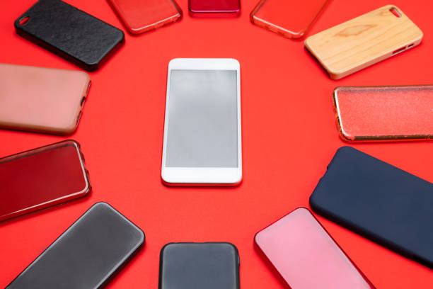 istock Choice of multicolored plastic back covers for mobile phones on red background with a smart phone on the side 1333338886