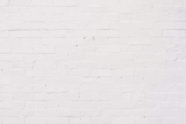 istock Part of an old brick wall painted white 1333342427