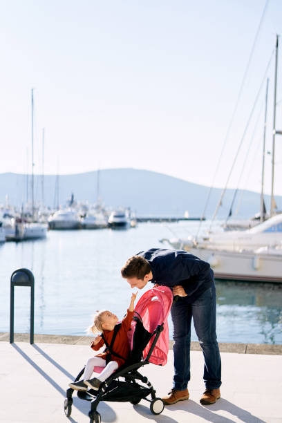 istock Father And Daughter Standing At Harbor 1333343615