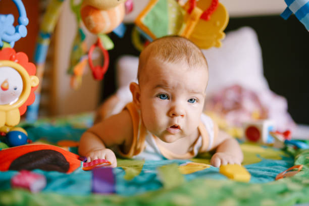 istock Cute Baby Girl Playing At Home 1333343679