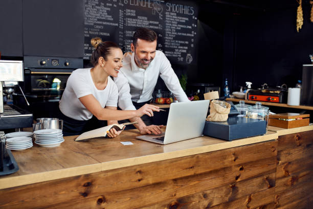 istock Two cafe owners working together planning supply orders on laptop 1333346499