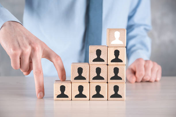 istock Businessman hold and put wooden cube block shape with user icon on grey table. Space for text. Internet icons interface foreground. global network media concept,contact on virtual screens ,copy space 1333346845
