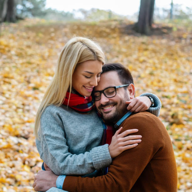 istock Romantic couple in autumn park 1333348741