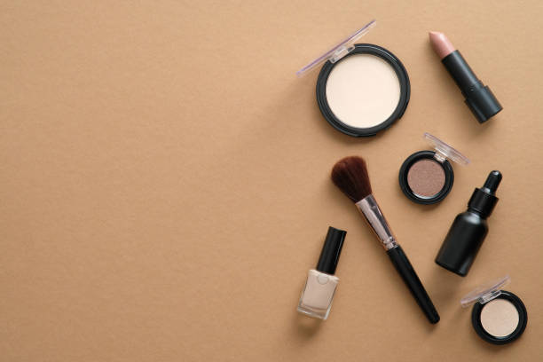 istock Makeup professional cosmetics on brown background. Flat lay, top view, overhead. 1333348955