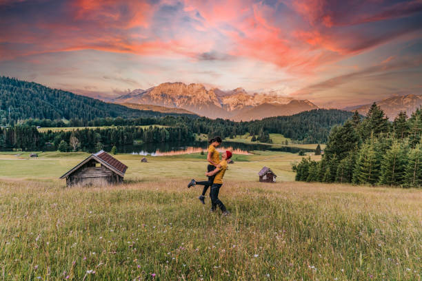 Young Couple in love, hikers resting on a hill. Shot of a young couple having fun together outdoors