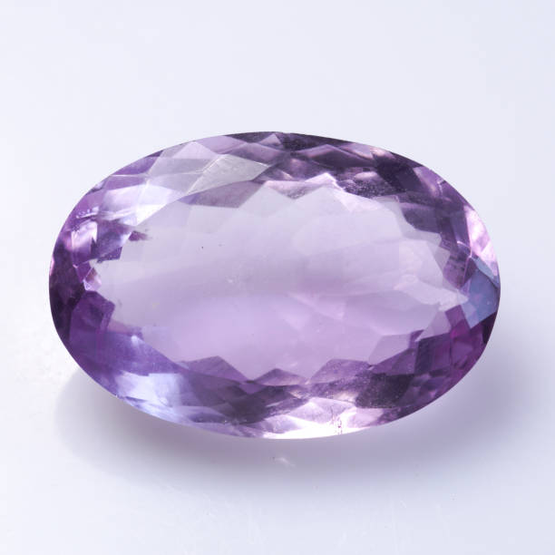 istock Natural stone purple amethyst on a white background 1333351064