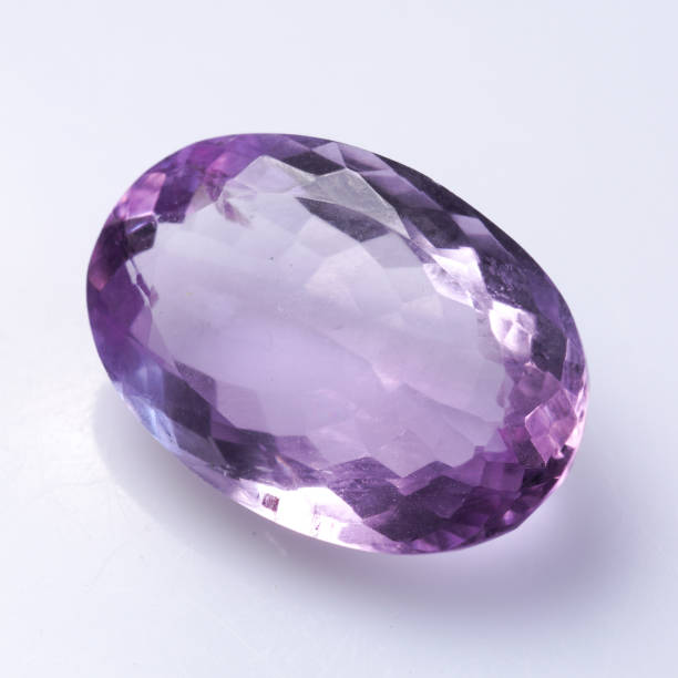 istock Natural stone purple amethyst on a white background 1333351066