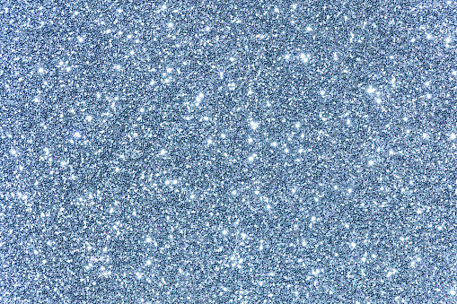 White blue lights glitter background, sparkling shiny. Christmas holiday decoration