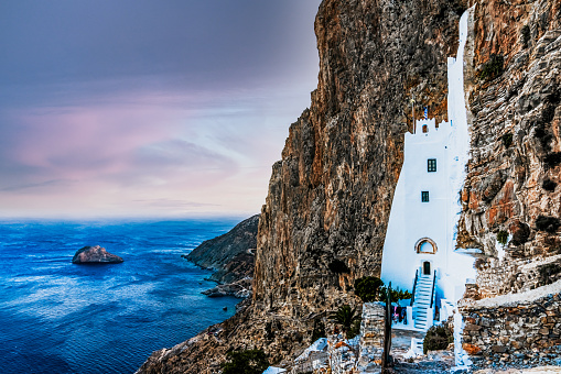 The Monastery of Hozoviotissa in Amorgos is the second oldest in Greece built in 1017 and renovated 1088, built by Alexius Comnenus I. It is literally hanging on the cliff side 300 m above the sea. The monastery was created as an ode (poem) to the Grace of Panagia, known as the Virgin Mary, which is the patron saint of the island. The icon is carried around to all the villages on the island every year.