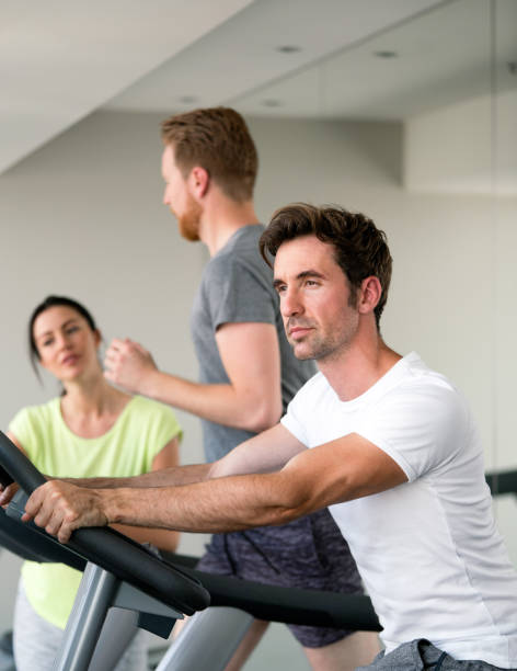 istock Young fit people cardio workout at gym 1333357658