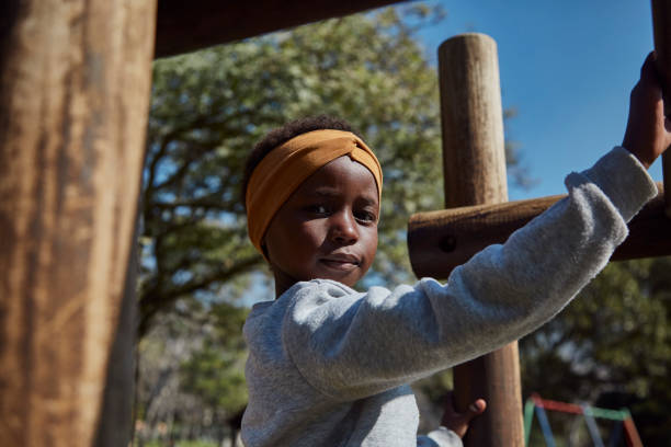 istock Young black girl at park 1333357802