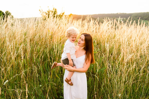 istock Mother with her son in her arms in nature 1333358675