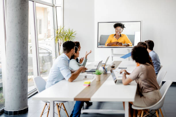 Engaging with international clients Video call group business people meeting on virtual workplace or remote office. Telework conference call using smart video technology to communicate colleague in professional corporate business. conference call stock pictures, royalty-free photos & images