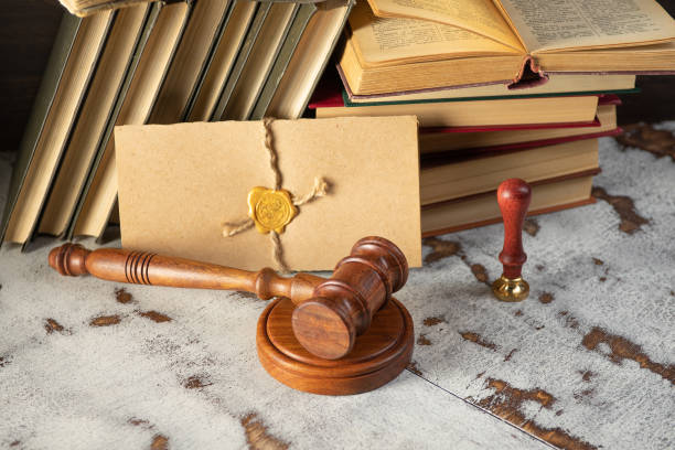 istock Gavel Notary's public and stamp on testament and last will. Notary public tools 1333360389