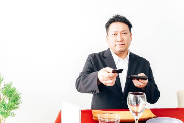 istock Man making credit card payment at restaurant 1333361637