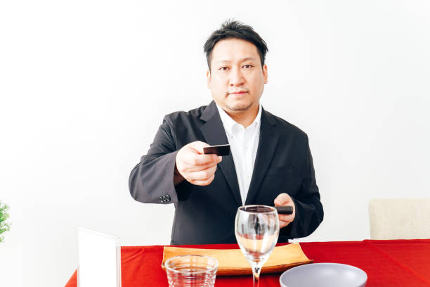 istock Man making credit card payment at restaurant 1333361638
