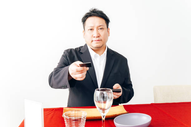 istock Man making credit card payment at restaurant 1333361648