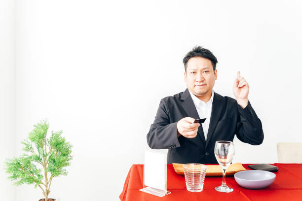 istock Man making credit card payment at restaurant 1333361651