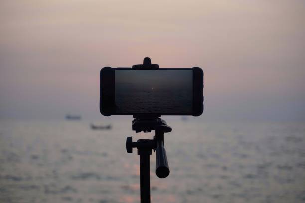 istock Smartphone on tripod captures sunrise video 1333363233