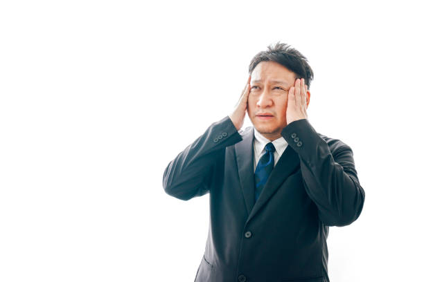 istock Middle-aged man in suit suffering from headache 1333366206