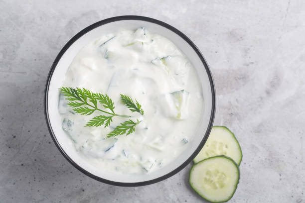 Traditional Indian Raita with Dahi in a bowl with spices stock photo