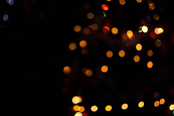 istock yellow bokeh lights defocus on a black background 1333366439