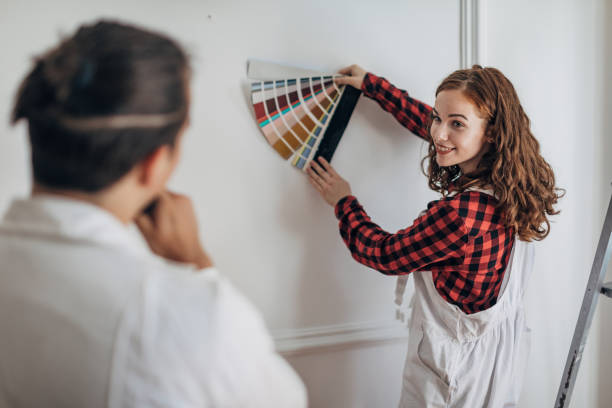 istock Young couple choosing colors for walls 1333371731