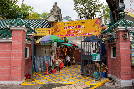 Hong Kong - August 10, 2021 : Wong Tai Sin Temple, Kowloon, Hong Kong. Shops selling joss sticks, candles and worship stuffs. Wong Tai Sin Temple is one of the most famous temples in Hong Kong.