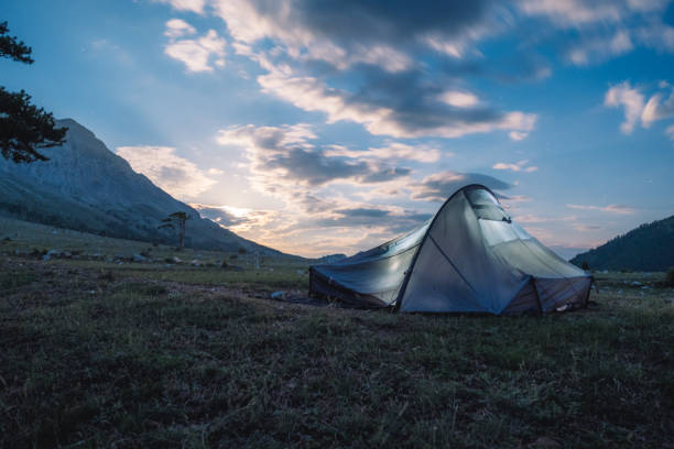 istock tent moonrise in nature,long exposure,moving clouds 1333379831