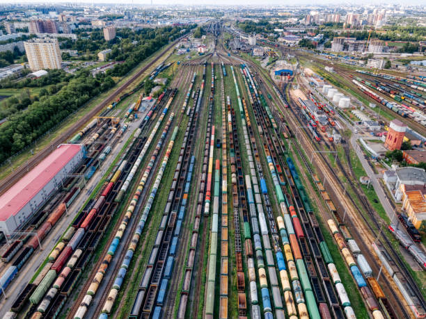 istock Aerial top view on railways with various colorful cargo wagons. 1333379879