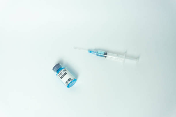 istock Blue liquid bottles vaccine and injection 1333383844