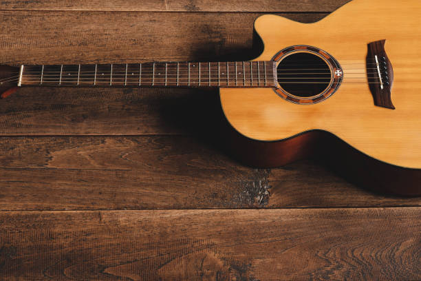 istock classical guitar on wooden background 1333383853