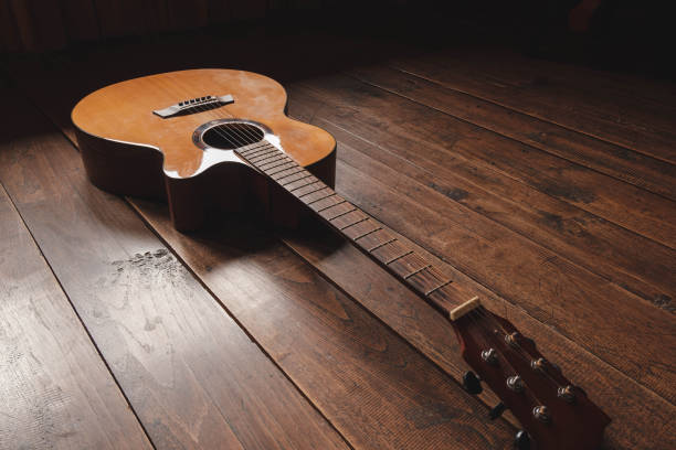 istock classical guitar on wooden background 1333383869