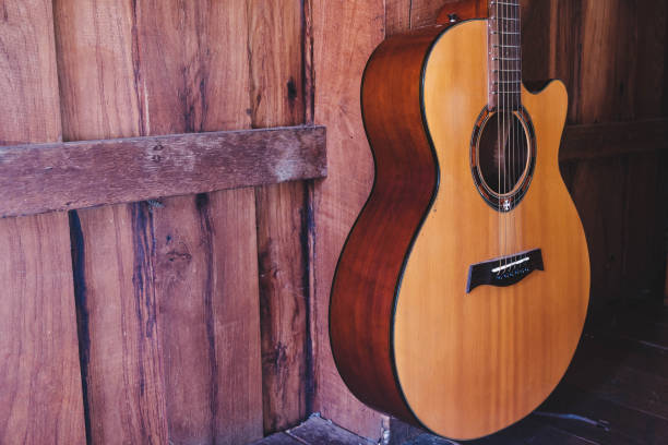 istock classical guitar on wooden background 1333383870
