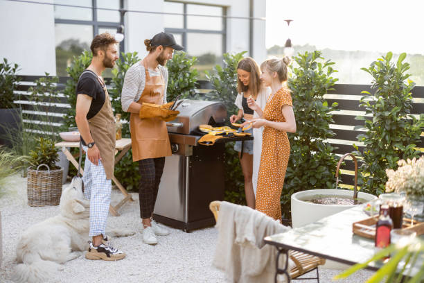istock Young people grilling food at backyard 1333387958