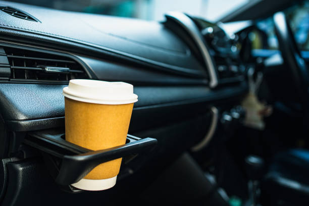 Cup of coffee in a car cup holder.