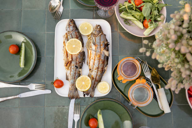 istock Grilled fish on a green table outdoors 1333389283