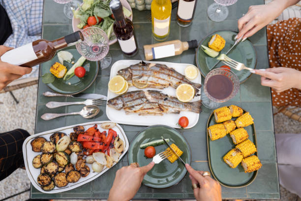 istock People eating and drinking at beautifully served table 1333389315