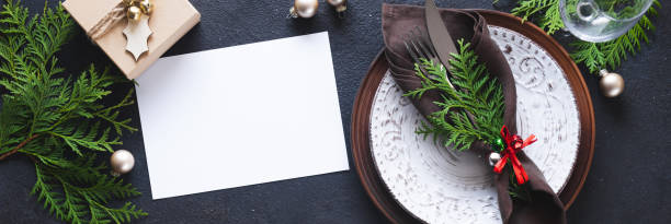 istock Christmas table setting with mockup of greeting card or invitation. 1333392923