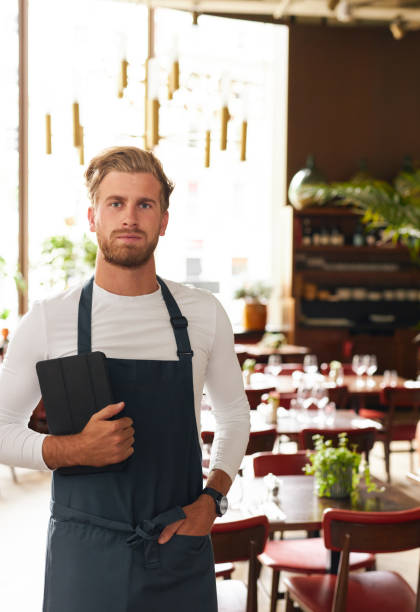 Portrait of restaurant manager with tablet