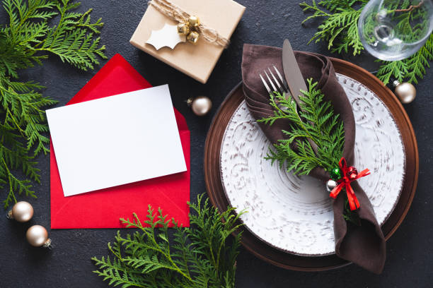 istock Christmas table setting with mockup of greeting card or invitation. 1333393453