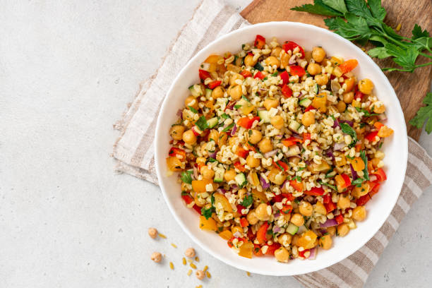 istock Salad of bulgur, chickpeas and vegetables in a bowl 1333393774