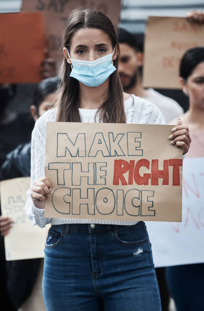 istock Shot of a young woman protesting at a march 1333393927