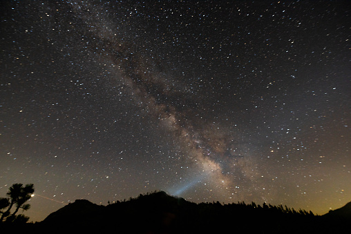 A comet passes through Earth's atmosphere above Lake Powell, Utah.