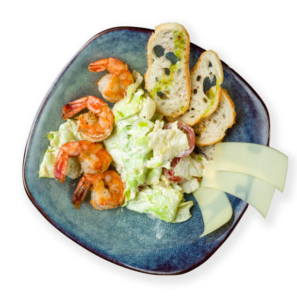 istock salad caesar with shrimps top view isolated on white background 1333396861