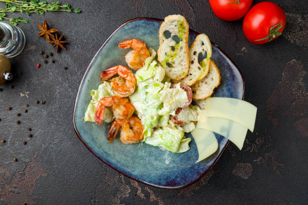 istock salad caesar with shrimps top view on brown table 1333397415