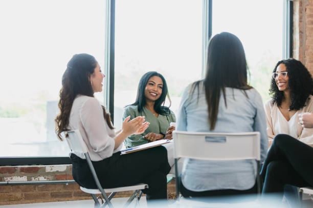 istock At meeting during workday, diverse women smile as they bond 1333397821