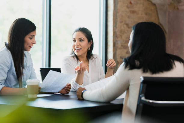 istock Women discuss spreadsheet numbers with financial advisor 1333397843